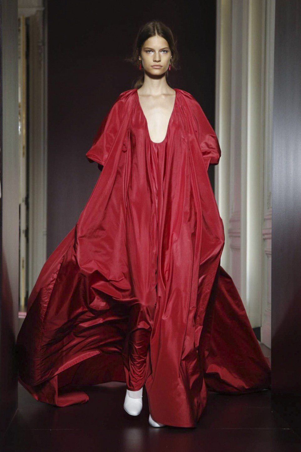 Editorial photograph of a red Valentino Haute Couture
